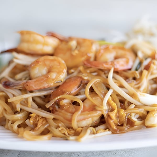 Close-up of Cilantro Thai Express's Pad Thai with shrimp, noodles, and bean sprouts.